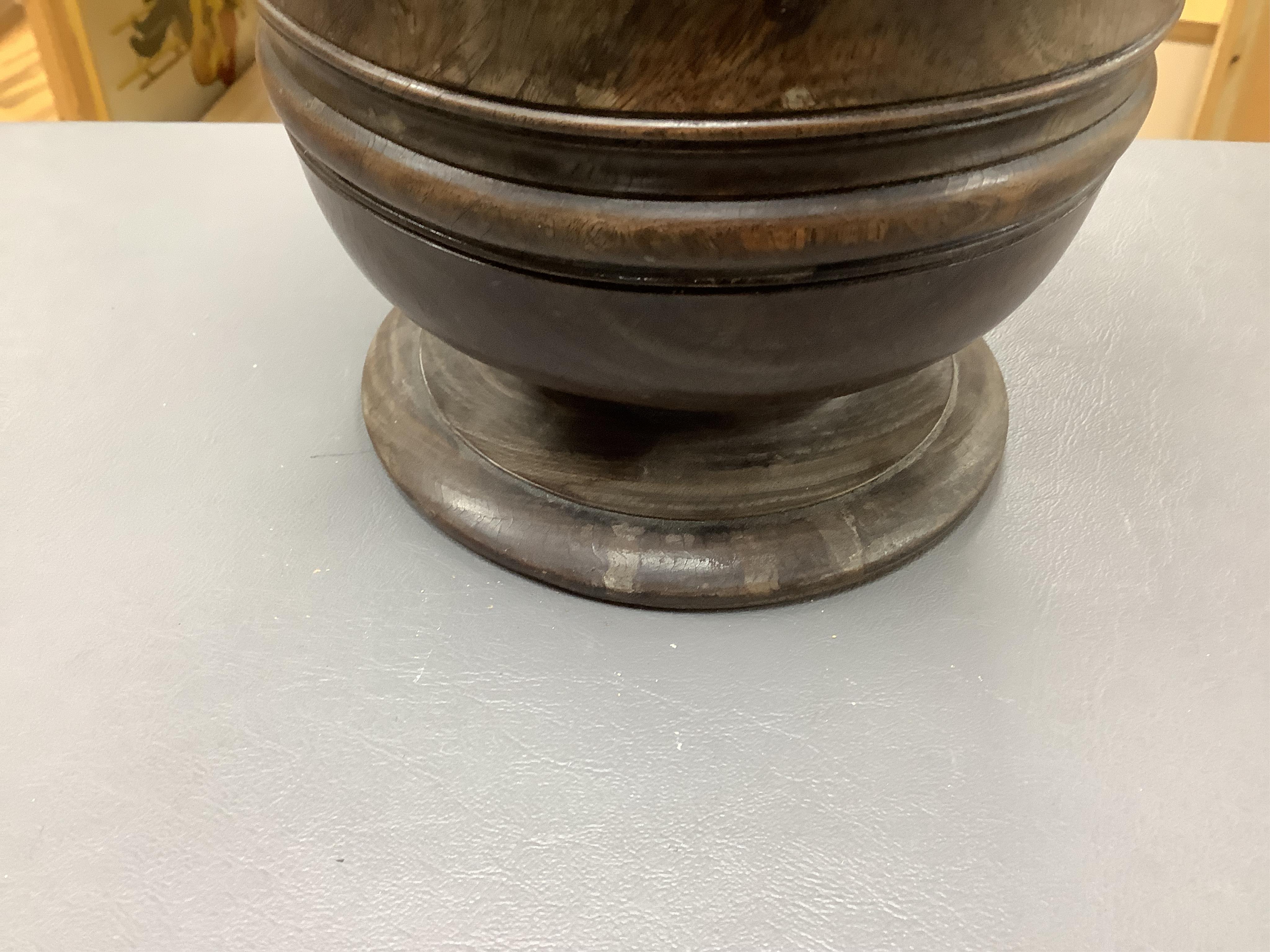 An 18th/19th century lignum vitae wassail bowl and a circular mahogany tobacco box, largest 18cm high